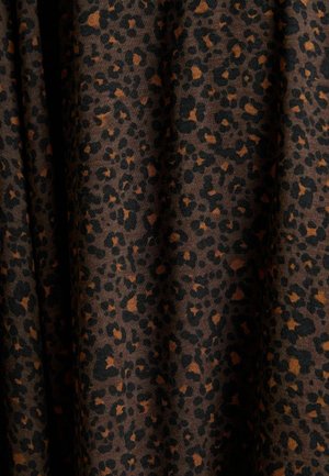 Leopard print fabric featuring a blend of black and orange spots on a dark brown background, showcasing a smooth, soft texture.