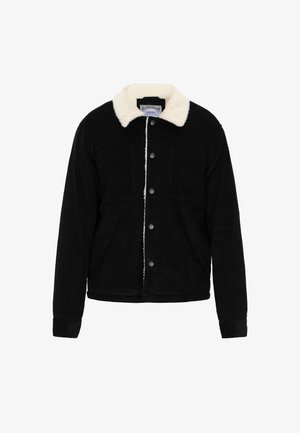 Schwarze Cordjacke mit einem hellen Kunstfellkragen, vorderem Knopfverschluss und zwei Brusttaschen mit strukturiertem Finish.