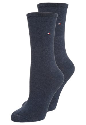Marineblauwe katoenen sokken met een geribde bovenkant, naadloze teen en een klein geborduurd logo met rode, witte en blauwe accenten.