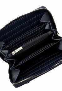Navy leather wallet with multiple card slots, a central zippered compartment, and silver-tone hardware along the zipper. Textured interior lining.