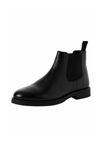 Botas Chelsea de cuero negro con paneles laterales elásticos y tirador, que cuentan con una punta redondeada y suela de goma plana, textura suave.