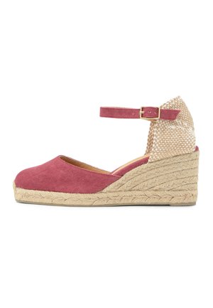 Wedge espadrille sandal with pink fabric upper, ankle strap with gold buckle, woven beige heel counter, and braided jute platform sole.