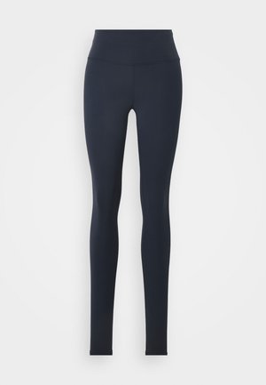 Mørkeblå høj taljede leggings lavet af strækbart stof med en glat tekstur, der har et tætsiddende design uden synlige mønstre eller detaljer.
