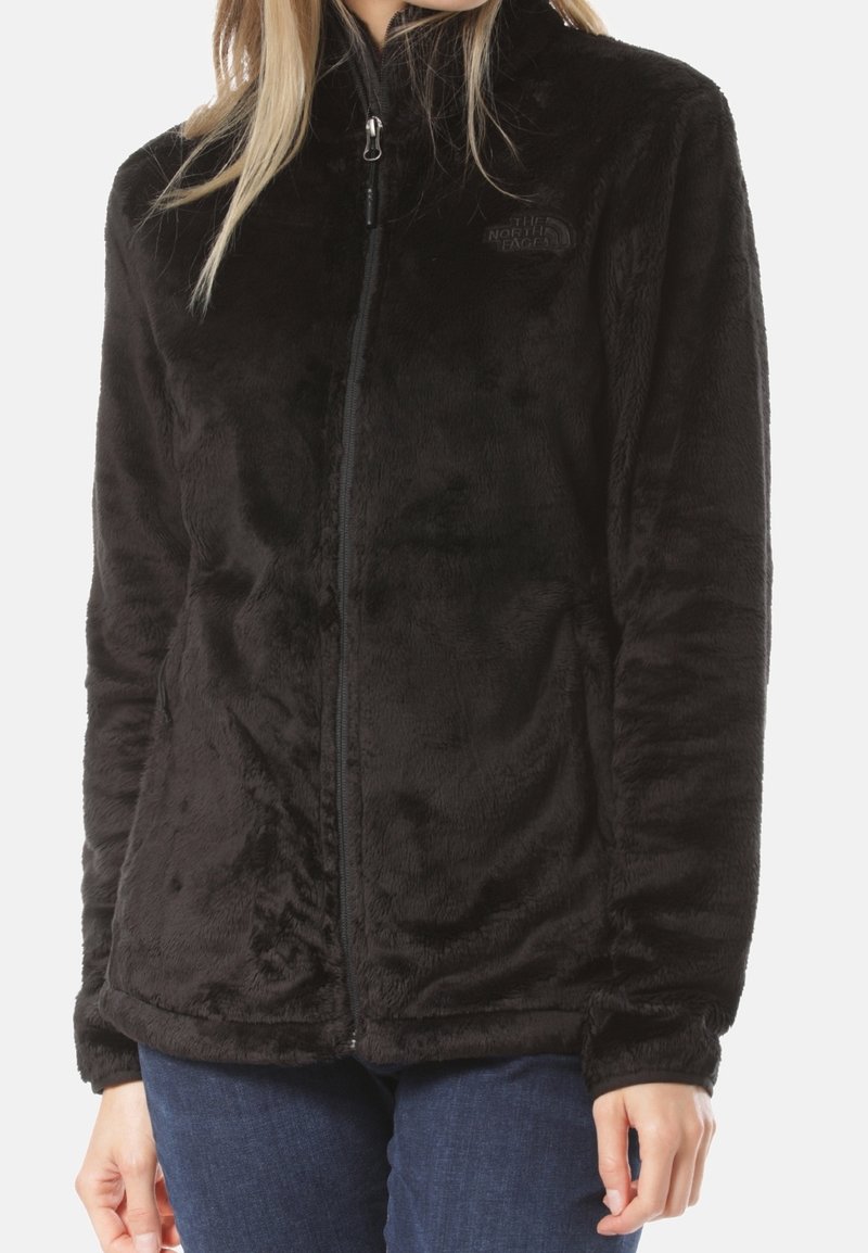 Schwarze Fleecejacke mit Reißverschluss vorne, hohem Kragen und weicher Textur. Verfügt über das Markenlogo auf der Brust und lange Ärmel.