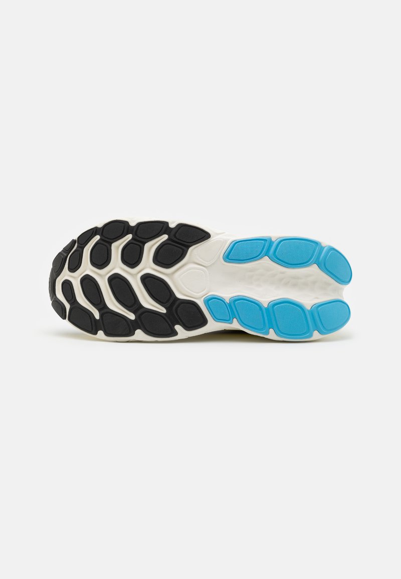 Suola della scarpa con un motivo esagonale in gomma nera, intersuola bianca e sezioni blu, progettata per grip e ammortizzazione.