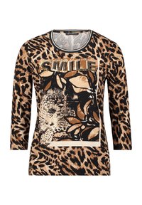 T-shirt à manches longues avec un design imprimé léopard en beige et noir, présentant un graphique central "SMILE" en strass. Tissu doux, col rond.