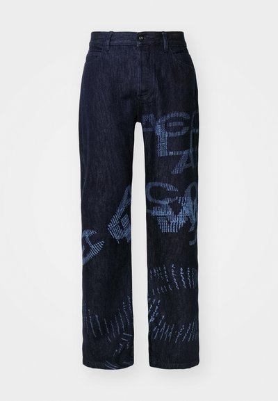 Dark denim pants featuring a loose fit with blue graphic patterns and a button closure. The fabric has a textured appearance and straight legs.
