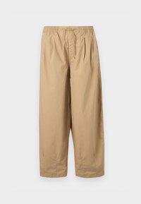 Beige, wide-leg trousers made from a smooth fabric, featuring an elastic waistband with a drawstring and side slit pockets.