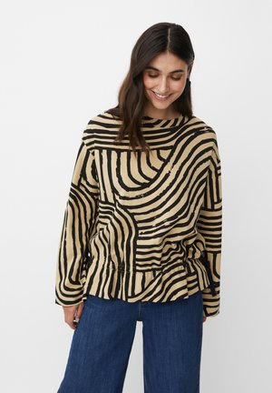 Camicia a maniche lunghe, beige con strisce astratte nere, caratterizzata da un colletto rotondo e una vestibilità rilassata. Tessuto morbido e testurizzato con una leggera lucentezza.