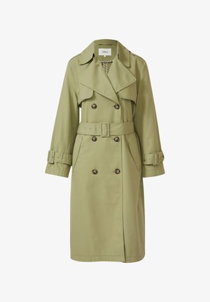 Trench-coat vert olive clair à double boutonnage avec larges revers, ceinture assortie, sangles aux poignets et poches latérales.
