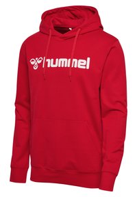 Felpa rossa con cappuccio e tasca frontale, dotata di cordino nel cappuccio e grande logo "hummel" bianco. Realizzata in tessuto morbido con polsini a costine.