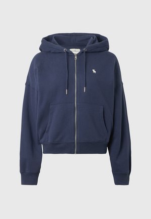 Dunkelblauer Zip-Hoodie aus weichem Material, mit einer Kängurutasche, lockerer Passform und einem kleinen Logo auf der linken Brust.