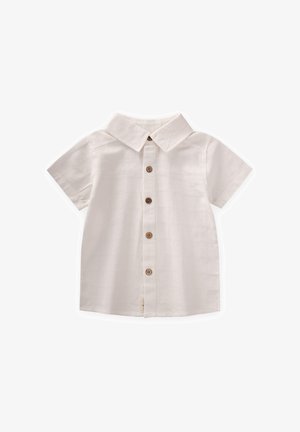 Košulja kratkih rukava u boji off-white od tkanine s teksturiranim uzorkom, klasičnog ovratnika i pet drvenih gumba sprijeda.