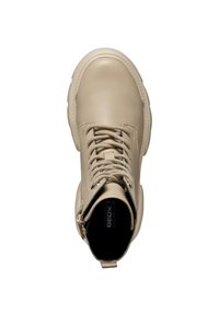 Stivale in pelle beige alla caviglia con punta rotonda, lacci e cerniera laterale. Suola spessa e texture liscia, dotato di soletta rimovibile.