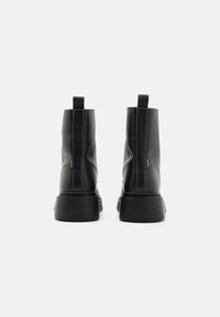 Levi's® Stivaletti con plateau - black