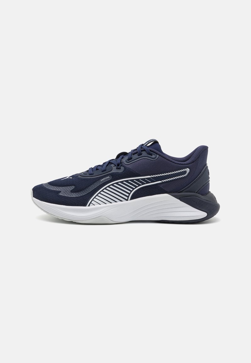 Navy blue athletic shoe with a textured fabric upper, white stripe detailing, cushioned sole, and lace-up design. Suitable for sport.