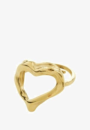 Gold ring shaped like a heart, featuring a wavy, textured surface and an open center. The band is smooth and slightly irregular.