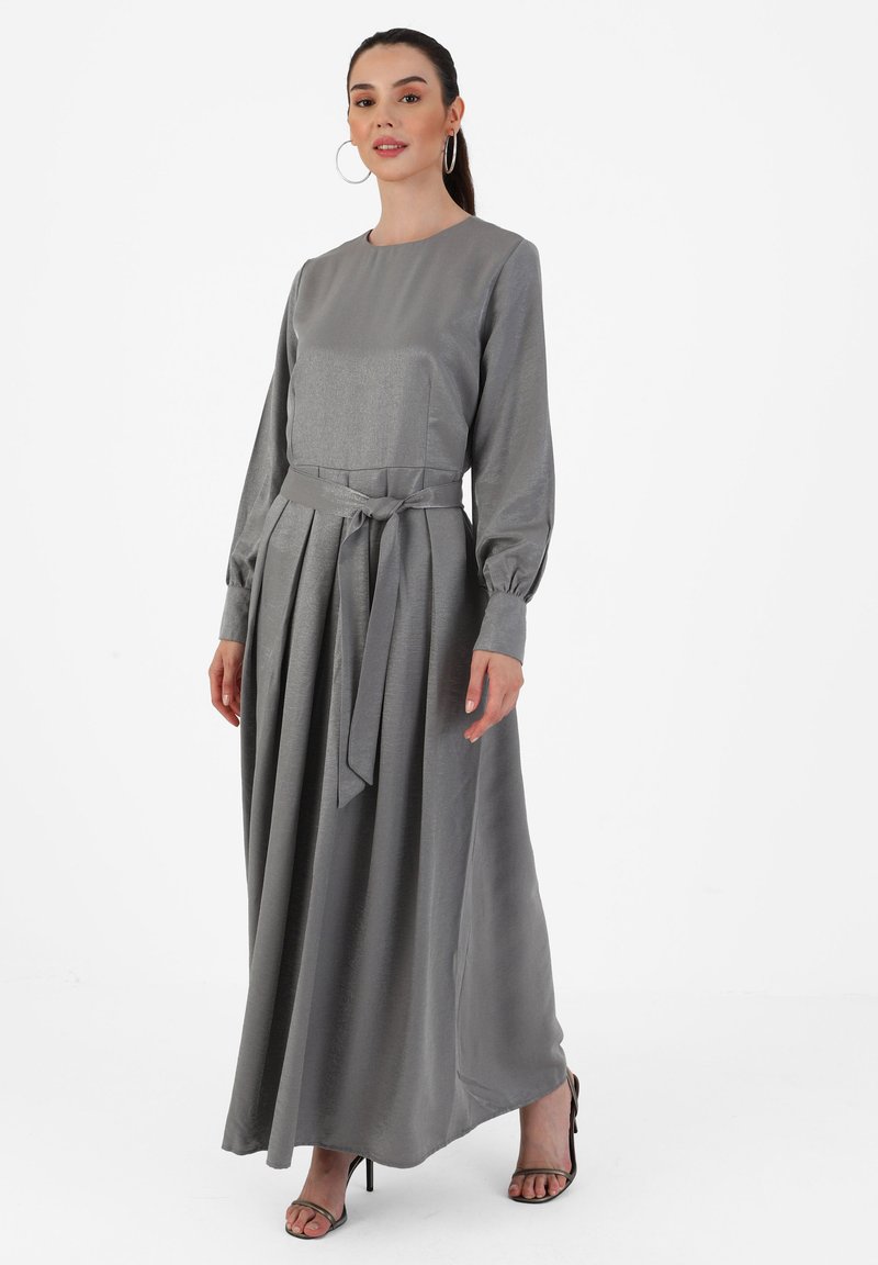 Gray long-sleeve dress with a round neckline, cinched waist, and pleated skirt; made from smooth fabric; finished with a tied belt.