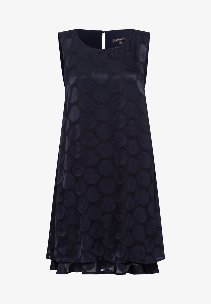 Robe bleu marine sans manches à grands pois texturés, encolure ronde et légère silhouette évasée.