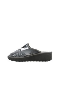 Zoccoli slip-on a fantasia bianca e nera con una tomaia liscia, suola a zeppa e suola in gomma texture per una migliore aderenza.