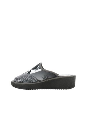 Zoccoli slip-on a fantasia bianca e nera con una tomaia liscia, suola a zeppa e suola in gomma texture per una migliore aderenza.