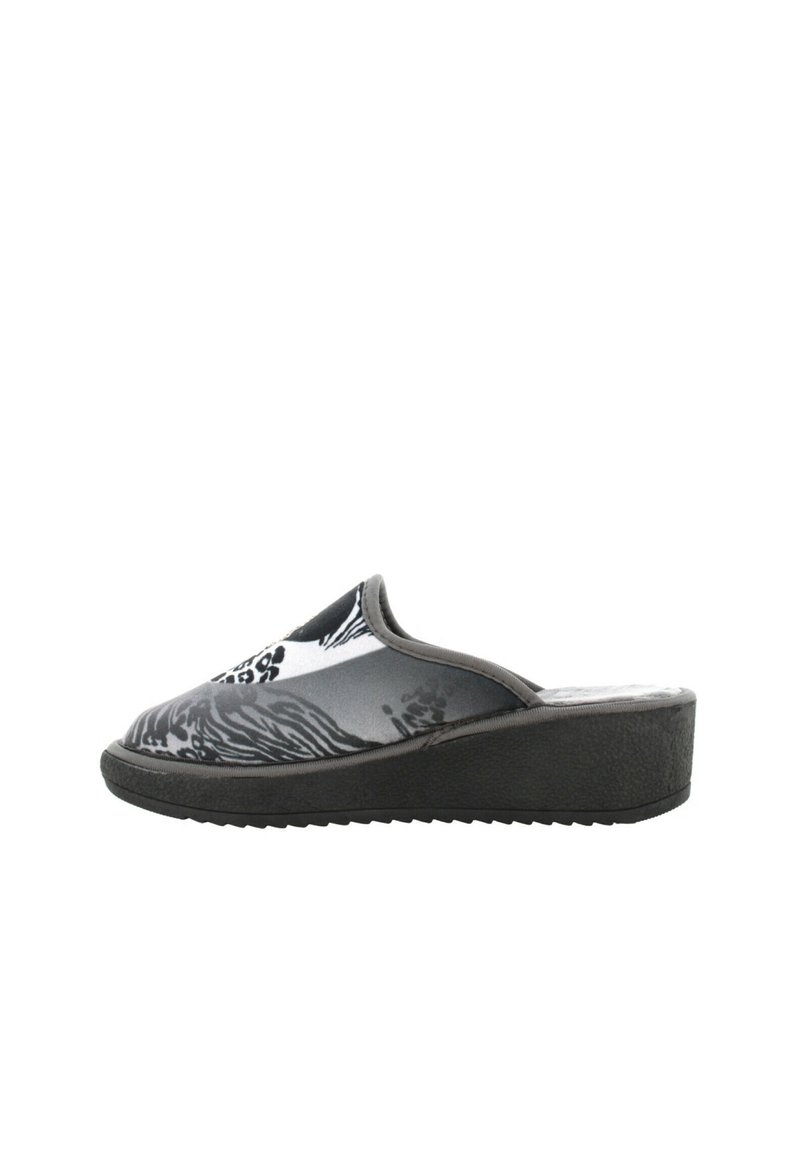 Zoccoli slip-on a fantasia bianca e nera con una tomaia liscia, suola a zeppa e suola in gomma texture per una migliore aderenza.