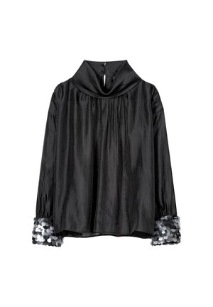 Schwarzes, strukturiertes Oberteil mit drapiertem Schalkragen, langen Ärmeln und silbernen Paillettenakzenten an den Bündchen. Rückenöffnung mit Knopfverschluss.