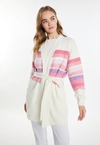 Weißer Cardigan mit horizontalen Streifen in Pink, Lila und Lavendel. Weicher Stoff, taillierter Schnitt und Schalkragen. Lange Ärmel mit gerippten Bündchen.