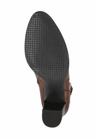 Talpă de pantof din piele maro cu fund de cauciuc negru texturat. Tocul are o finisare netedă și o formă rotundă. Imprimare notabilă a logo-ului pe talpă.