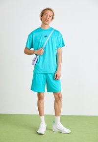 Nike Sportswear Teplákové kalhoty - dusty cactus