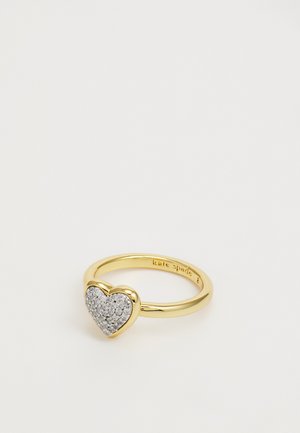 Gold ring with a heart-shaped design, featuring a paved surface of small silver stones, polished finish, and smooth band.