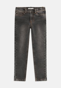 Dark grey denim jeans with a slim fit, featuring five pockets and orange stitching. The fabric has a slightly faded texture.