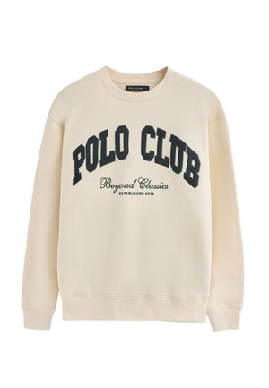 Kremowa bluza z napisem "POLO CLUB" wytłoczonym grubymi czarnymi literami, z okrągłym dekoltem oraz ściągaczami przy mankietach i u dołu.