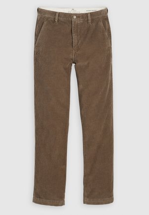 Bruine corduroy broeken met een rechte pijp ontwerp, voortassen en een knoopsluiting. Getextureerde stof met verticale ribbels.