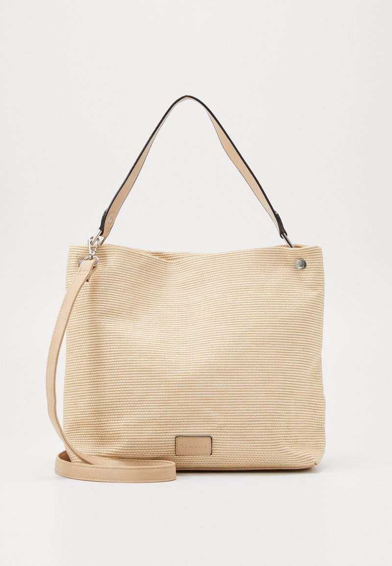 Beżowa torebka o teksturowanej powierzchni w paski. Posiada krótki czarny pasek na ramię oraz dłuższy beżowy pasek do noszenia na ukos. Akcenty w kolorze srebrnym.