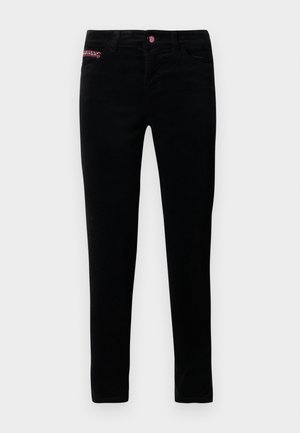 Zwarte slim-fit jeans met een rood-wit patroon op het kleine voorvak en een rode knoopsluiting.