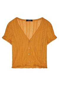 Senapsgul kortärmad kofta med V-ringning, med texturerad stickning, fem knappar fram och en kortad nederkant.