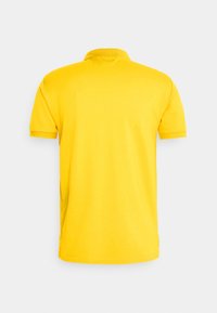 Yellow polo shirt with short sleeves and a classic collar. Made of smooth cotton material, features a plain design without patterns or accents.