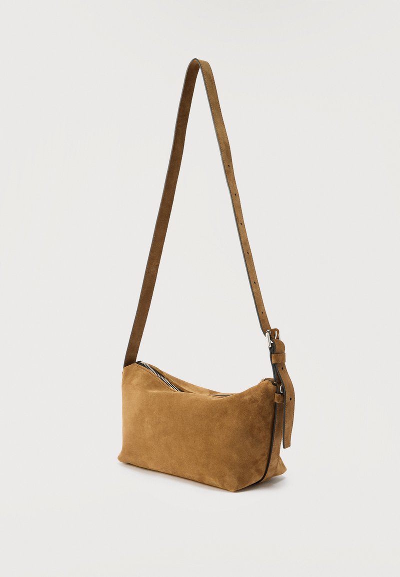 Brown suede shoulder bag with adjustable strap and zipper closure, shown against a plain light background.