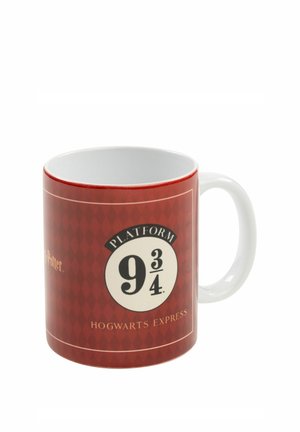 Red ceramic mug with a white handle featuring the Platform 9 3/4 logo and "Hogwarts Express" text from Harry Potter.