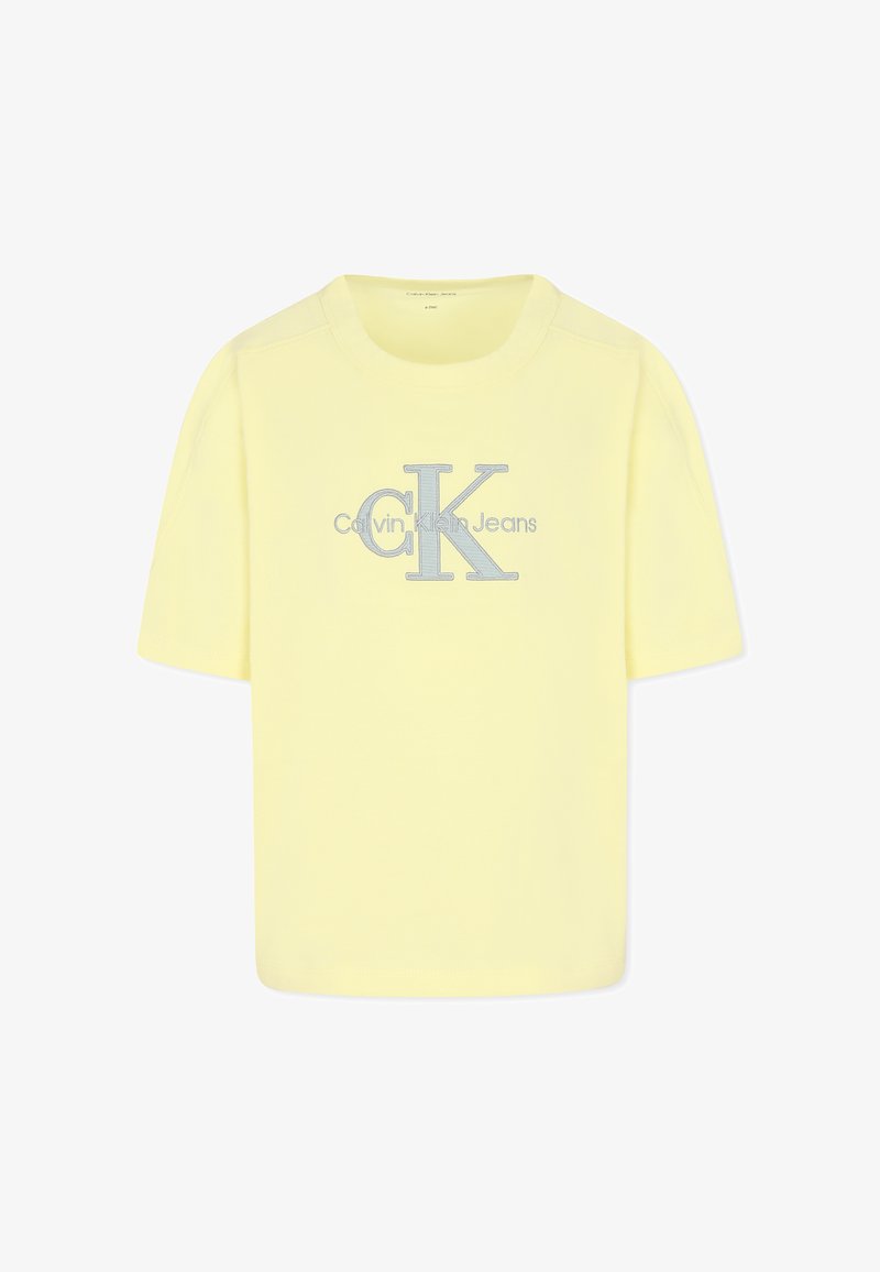 T-shirt in cotone giallo a maniche corte, con logo "CK" e testo "Calvin Klein Jeans" in ricamo argento sulla parte anteriore.