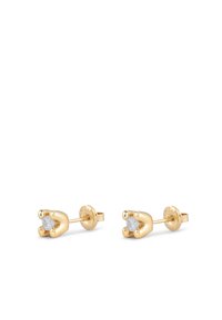 Boucles d'oreilles en métal doré avec un design en forme de griffe, ornées de deux pierres claires au centre. Surfaces lisses avec une finition polie.