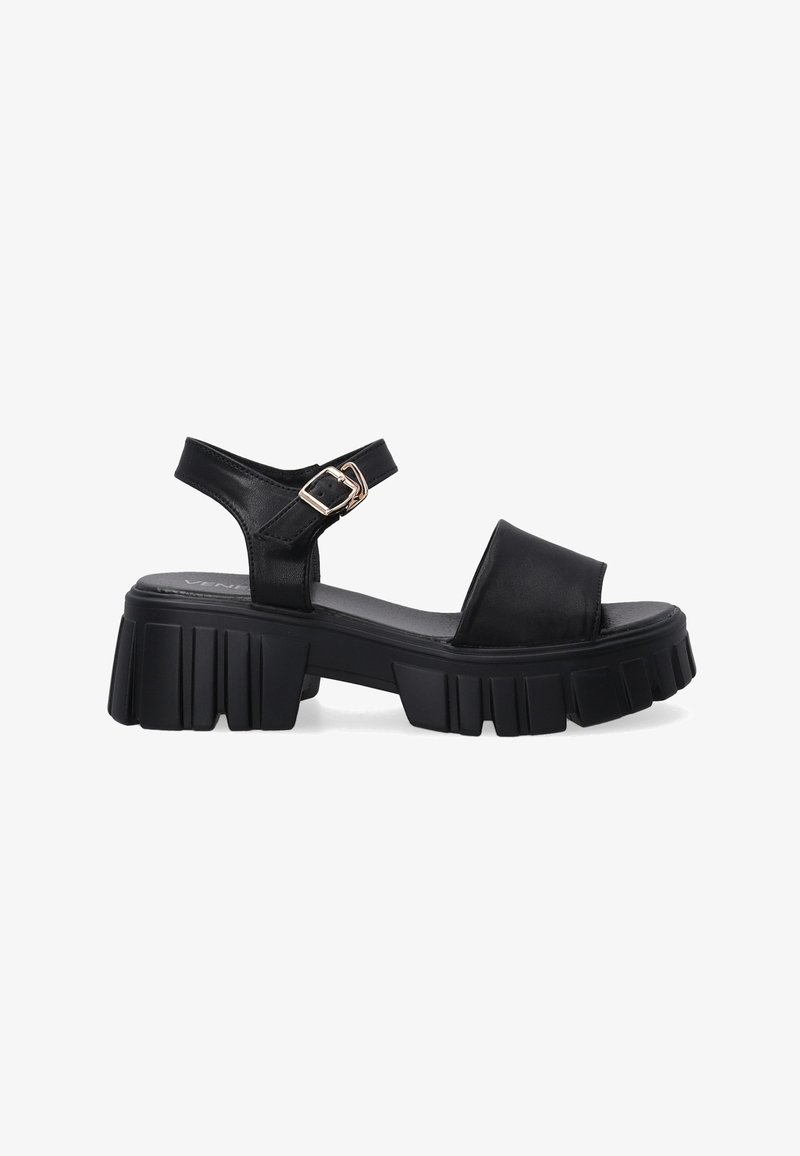 Black leather sandals with a chunky sole, open toe, and ankle strap featuring a metal buckle detail. Flat textured footbed for comfort.