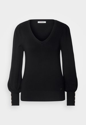 Pull en maille noir avec un col en V et des manches bouffantes. Comprend des boutons en métal doré aux poignets et un ourlet côtelé. Texture douce.