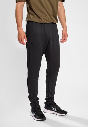 ACTIVE TRAINING - Tracksuit bottoms - obsidian