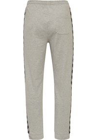 Graue Jogginghosen aus weichem Stoff, mit schmal zulaufenden Beinen, einem elastischen Taillenbund und schwarzen gemusterten seitlichen Streifen. Enthält eine Gesäßtasche.