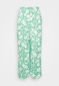 Zelené květinové kalhoty vyrobené z lehkého materiálu, s elastickým pasem a širokým, pohodlným střihem s bílými květinovými vzory.