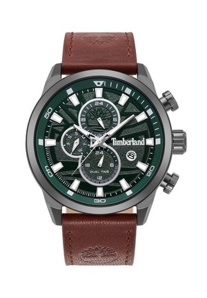 Montre chronographe avec un cadran vert à motifs, des index argentés et un bracelet en cuir brun. Les caractéristiques incluent plusieurs sous-cadrans et un double fuseau horaire.