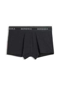 Schwarze Boxershorts mit elastischem Bund, auf dem in grauen Buchstaben das Branding "BERSHKA" zu sehen ist.
