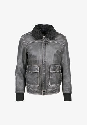 Grå læder bomberjakke med sort shearlingkrave, forreste klaplommer, ribbende manchetter og knaplukket taljebånd mod hvid baggrund.